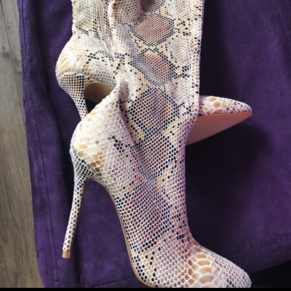 Thigh high snakeskin boots
